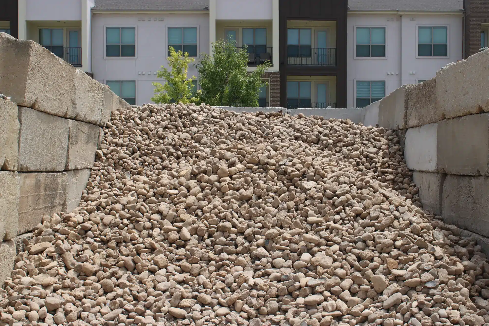 River rock and rip rap sizes for a dry creek bed